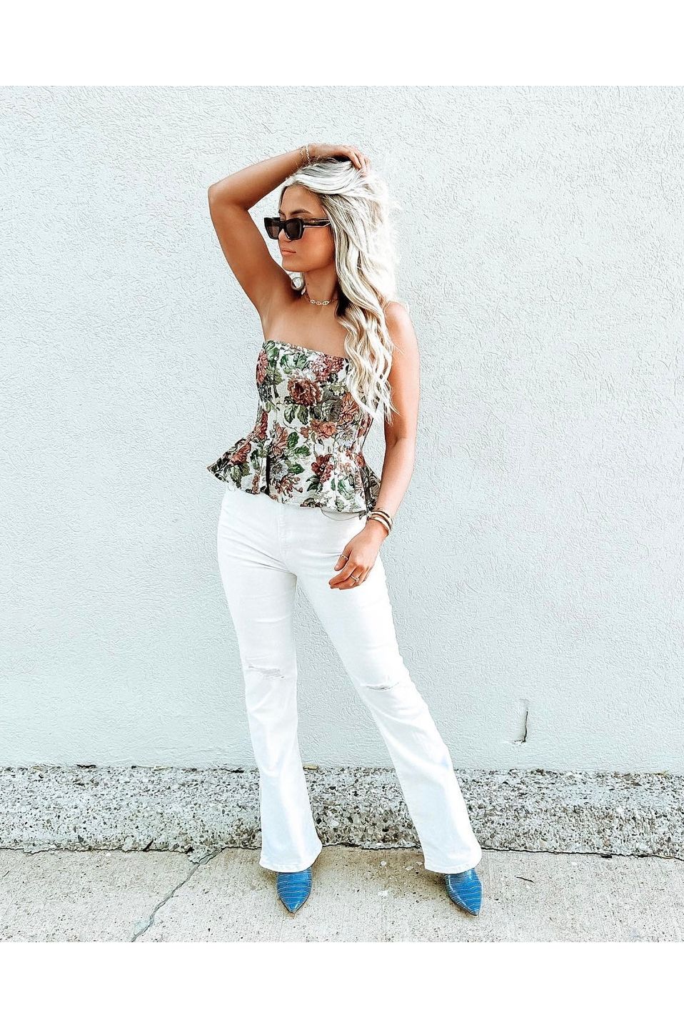 white floral corset top with jeans